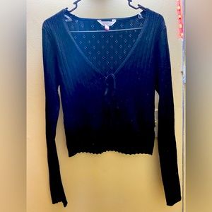 This is a black long sleeve cotton sweater. Size medium, no boundaries